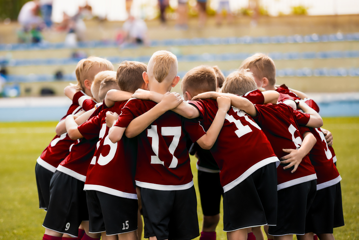Soccer kids huddled in a circle