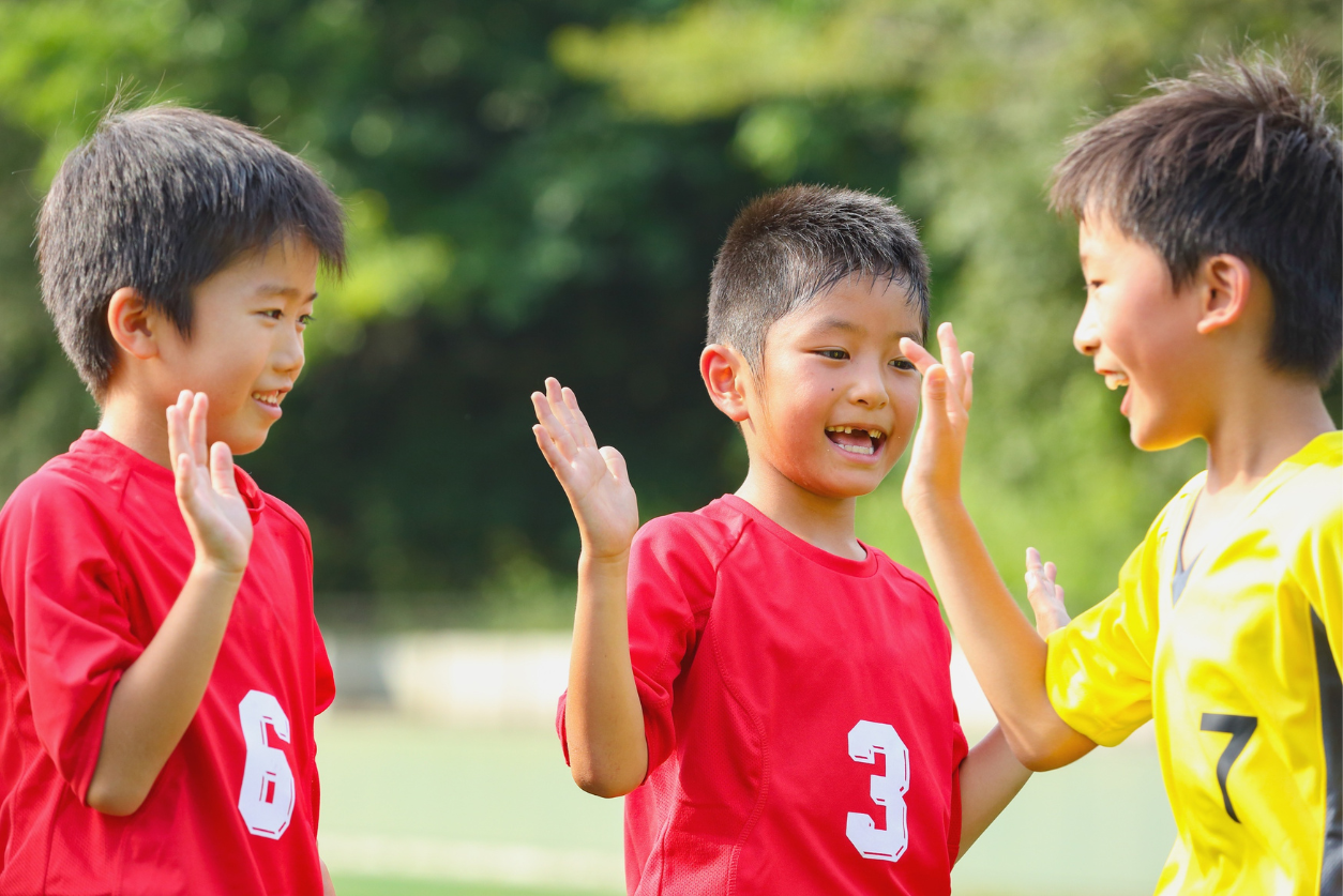 Kids giving eachother high fives
