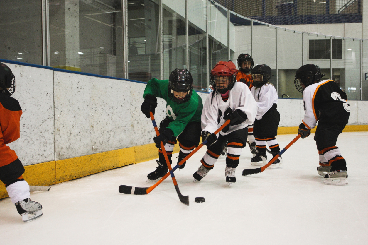 Kids playing in a hockey game